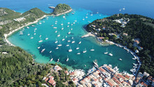 Aerial Drone Bird's Eye View Photo Of Iconic Small Port And Fishing Village Of Lakka With Traditional Ionian Architecture And Sail Boats Docked, Paxos Island, Ionian, Greece