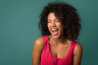 © Prostock-studio - Young african-american woman screaming on blue background