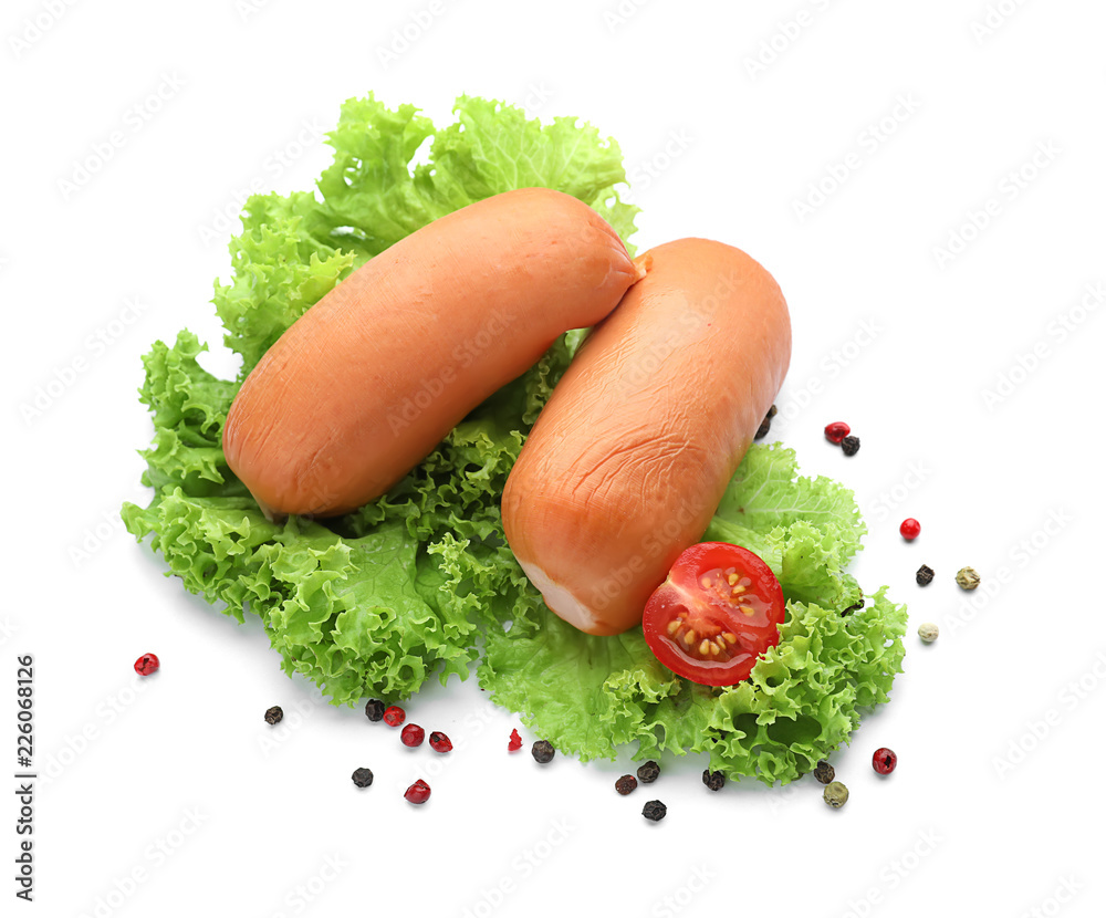 Delicious sausages with spices on white background