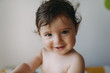 © Westend61 - Portrait of smiling baby girl at home