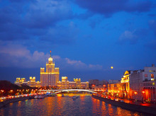 Evening View On The River, A Residential Skyscraper On Kotelnicheskaya Embankment, Moscow River, Bolshoy Ustinsky Bridge. Moscow, Russia