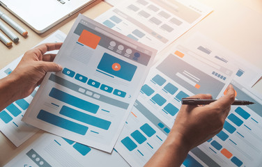 Website designer Creative planning application developer development draft sketch drawing template layout prototype framework wireframe design studio . User experience concept .