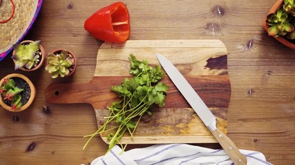 Wall Mural - Time lapse. Flat lay. Step by step. Slicing vegetables for filling to make empanadas.