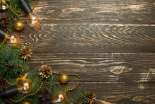 Christmas Rustic Background - Old Wooden Board With Backlight And Branches Of A Christmas Tree And Shyshkami And A Free Text Space