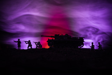 War Concept. Military silhouettes fighting scene on war fog sky background, World War German Tanks Silhouettes Below Cloudy Skyline At night. Attack scene. Armored vehicles.