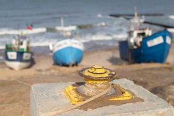 Winch for fishing boats on the Baltic Sea. Fishing port on the coast in central europe.