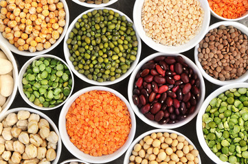 Wall Mural - Mix of dry legume varieties: pinto and mung beans, assorted lentils, soyabean, yellow and green peas, chickpea; vegan high protein food for healthy diet