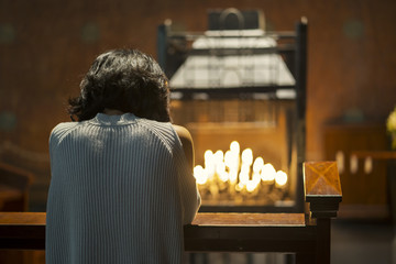 Christian woman praying in the church