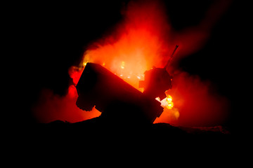 War Concept. Military silhouettes fighting scene on war fog sky background, World War German Tanks Silhouettes Below Cloudy Skyline At night. Attack scene. Armored vehicles. Tanks battle