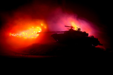 War Concept. Military silhouettes fighting scene on war fog sky background, World War German Tanks Silhouettes Below Cloudy Skyline At night. Attack scene. Armored vehicles. Tanks battle