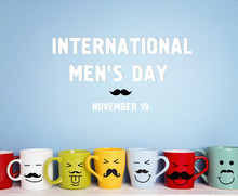 International Men's Day Background With Colorful Mugs With A Mustache.