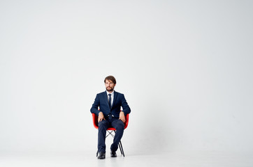 Poster - business man sitting on a chair