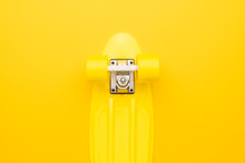 Bright Yellow Mini Cruiser Board On Yellow Background