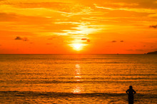 View Of Orange Sea Sunrise And Silhouette Single People In Thailand