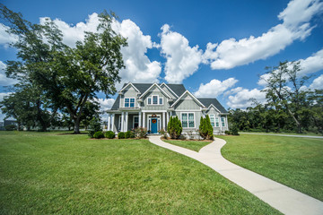 Gray New Construction Modern Cottage Home with Hardy Board Siding and Teal Door with Curb Appeal