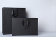 © 5second - Black shopping bags on grey background