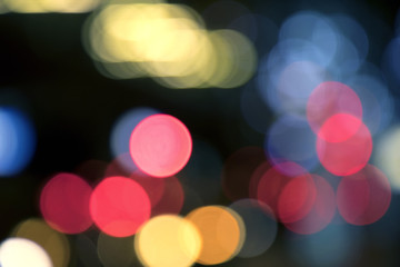 Wall Mural - Blurry background image of defocused colorful lights at night