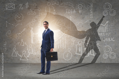 Fotografering Businessman and his shadow in business concept