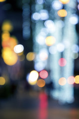 Wall Mural - Blurry background image of defocused colorful lights at night