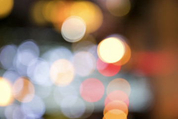 Wall Mural - Blurry background image of defocused colorful lights at night