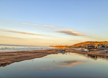 Reflections In Water Poolson Beach At Sunset Over Sandsend, Whitby, North Yorkshire Coast, England