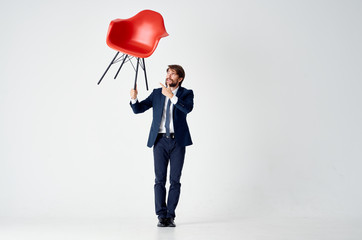 Poster - business man holding a chair