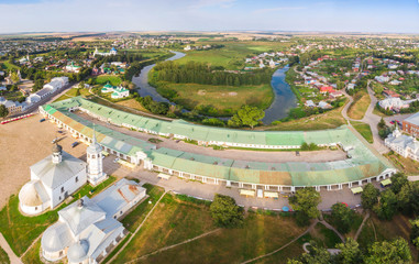 Wall Mural - Beautiful panoramic view of Suzdal in summer at sunrise. Resurrection Church on the market square in Suzdal. Suzdal is a famous tourist attraction and part of the Golden Ring of Russia