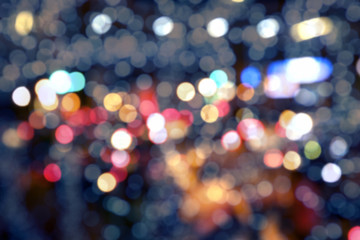 Wall Mural - Blurry background image of defocused colorful lights at night