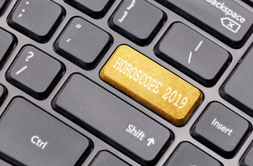 Aufkleber - Horoscope 2019 on golden enter key, of a black keyboard.