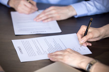 Close Up View Of Male And Female Hands Signing Two Contracts, Man And Woman Put Written Signature On Legal Papers Becoming New Partners Filling Business Document Form Promising Good Partnership Deal
