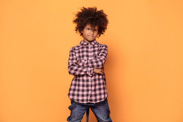 Little boy with afro hairstyle posing.