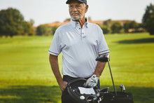 Smiling Senior Man Enjoying A Day At The Golf Course
