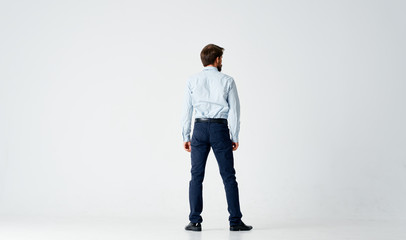 a man in a shirt is standing back