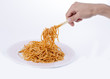 © hayaletsek - .man eating spaghetti with tomato sauce over white background