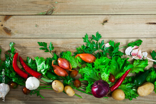 Fotografía Vegetables assortment on wooden background, vegan cooking concept