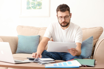 Canvas Print - Young man working at home