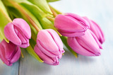 Fototapeta Tulipany - Pink Tulips. Flower background. Wooden background. Close up. 