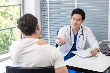 Athlete patient having a medical check up with a doctor