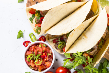 Wall Mural - Mexican pork tacos with vegetables and salsa.