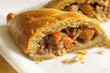 Welsh Oggie a regional delicacy from Wales of lamb leeks and vegetables baked in a short crust pastry case similar to a Cornish pasty