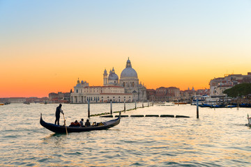 Wall Mural - Basilica Santa Maria della Salute and lagoon water at sunset, Venice, Italy