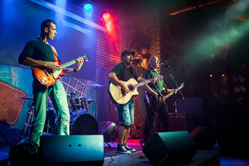 Wall Mural - Band performs on stage in a nightclub