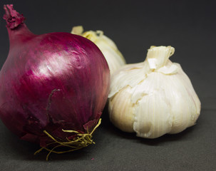 two heads of garlic and one purple onion