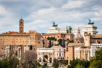 Wall Mural - Roman forum view with cloudy sky on the background