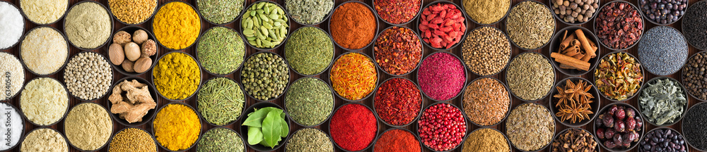 Various spices and herbs as a background. Colorful condiments in cups, top view - obrazy, fototapety, plakaty 