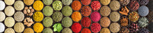 Various Spices And Herbs As A Background. Colorful Condiments In Cups, Top View