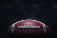 3d Rendering Of A Leather Ball For American Football Lying With Its Seams In Focus On A Dark Background.
