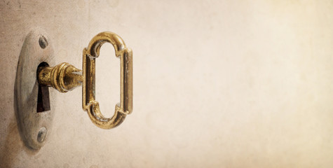 Fototapete - Old key in keyhole, macro shot. Retro style. Concept and Idea for History, business, security background. Write Your Text Here.