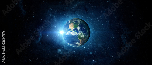 Cuadros en Lienzo Panoramic view of the Earth, sun, star and galaxy