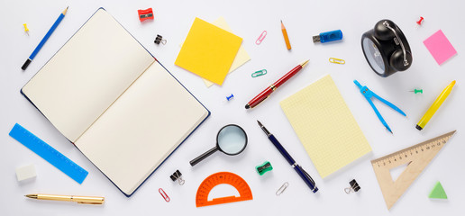 school accessories and open notebook or book